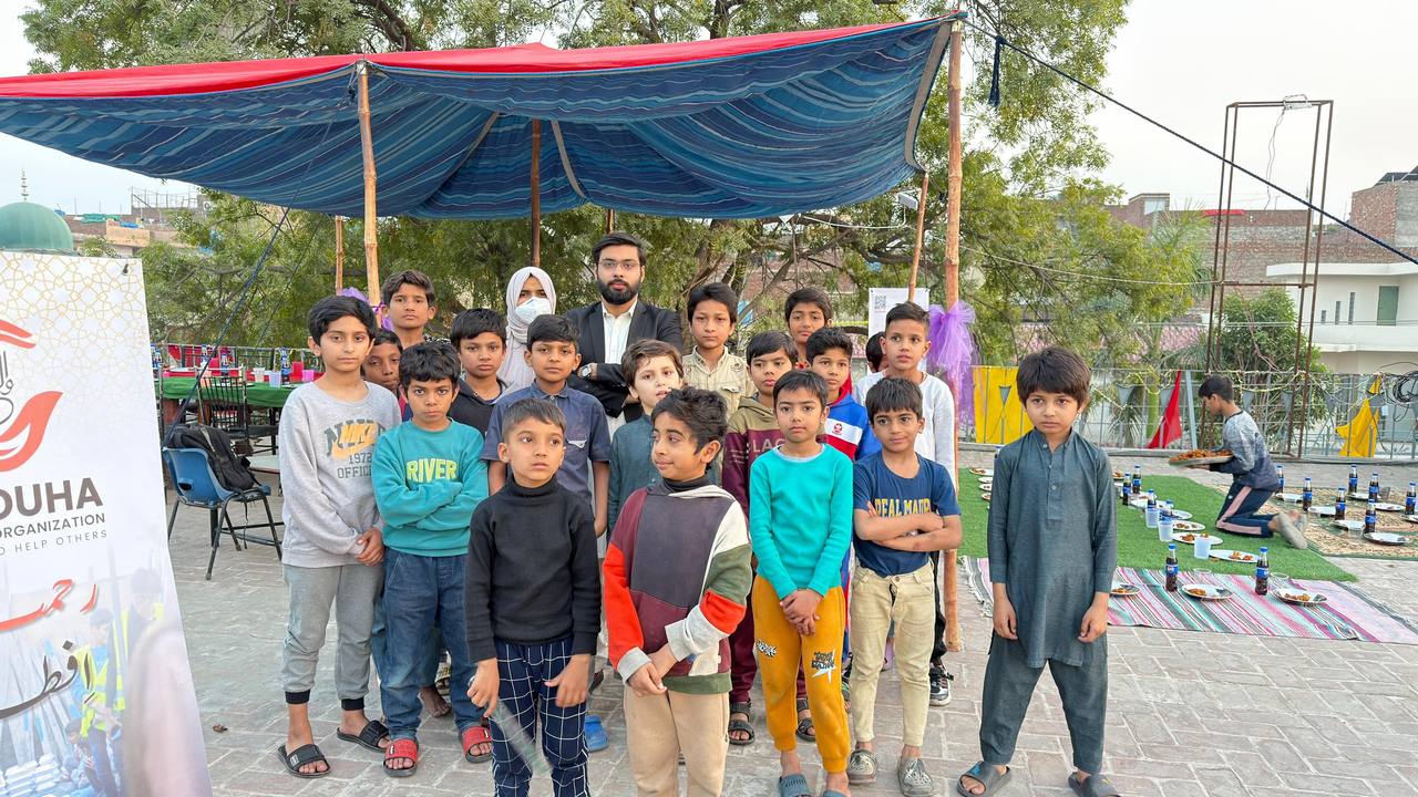 Community iftar gathering with children seated